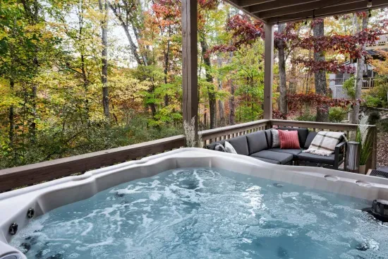 Soak under the canopy of colorful trees in the private hot tub. The perfect spot to relax after a day of hiking or skiing — nature, warmth, and tranquility all in one view.