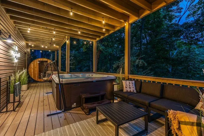 After a soothing soak in the hot tub, unwind in the lounge seating or step into the cedar sauna — a peaceful forest retreat made for relaxation.