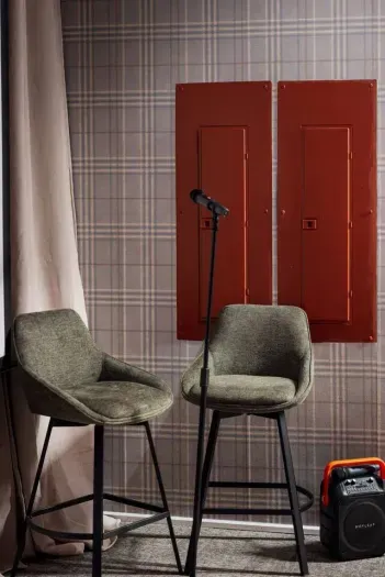 Gather for impromptu karaoke nights in this cozy lounge, complete with plush seating and your own stage-ready spotlight.