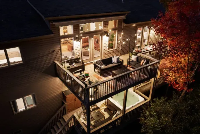 Unwind on the spacious two-level deck — complete with a hot tub, fire pit, and plenty of seating — the perfect spot for family dinners, stargazing, and cozy nights surrounded by nature.