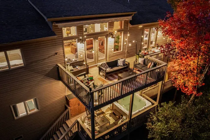 Unwind on the spacious two-level deck — complete with a hot tub, fire pit, and plenty of seating — the perfect spot for family dinners, stargazing, and cozy nights surrounded by nature.