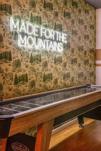 Game night ready with shuffleboard and a mountain vibe