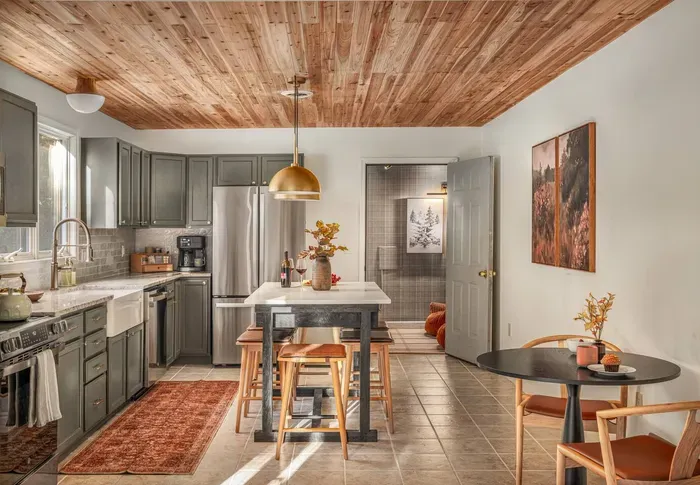 Enjoy cooking in our elegant and fully stocked kitchen, newly renovated with granite countertops, brass fixtures, a farmhouse sink, and brand-new stainless steel appliances.
