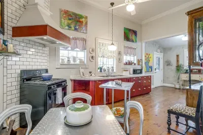 Bright and fully equipped kitchen with a stove, oven, and all the essentials for cooking