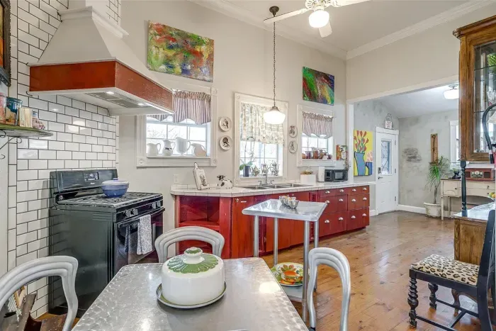 Bright and fully equipped kitchen with a stove, oven, and all the essentials for cooking