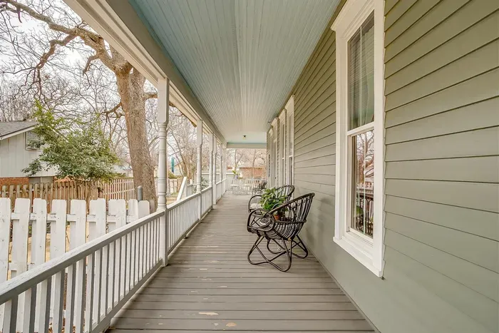 Side porch with seating, offering a peaceful spot to relax and enjoy the outdoors