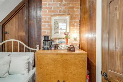 Enjoy a fully stocked coffee station and mini fridge, conveniently located within the loft