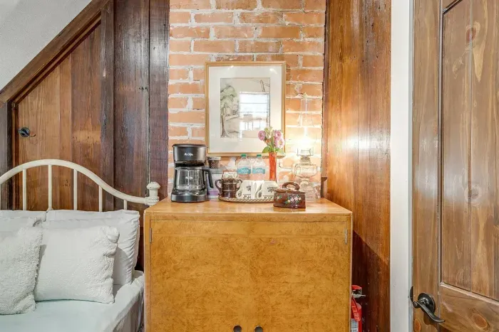 Enjoy a fully stocked coffee station and mini fridge, conveniently located within the loft