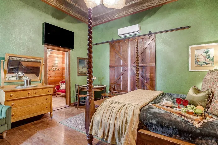 Rest in ultimate comfort on a luxurious California king bed with a charming four-post frame