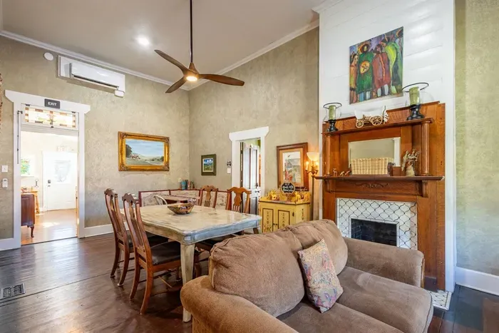 This combined dining area and living room creates a welcoming space for guests to gather. The comfortable seating and dining table provide a great spot to enjoy meals, play games, or spend time with loved ones.