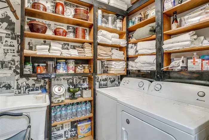 Conveniently equipped laundry room with ample storage for guest needs