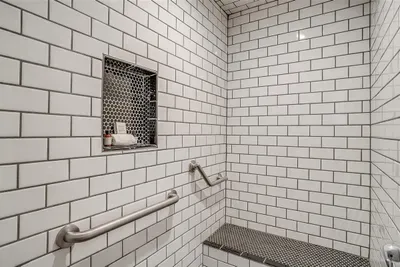Private ensuite with a spacious walk-in shower and stylish details