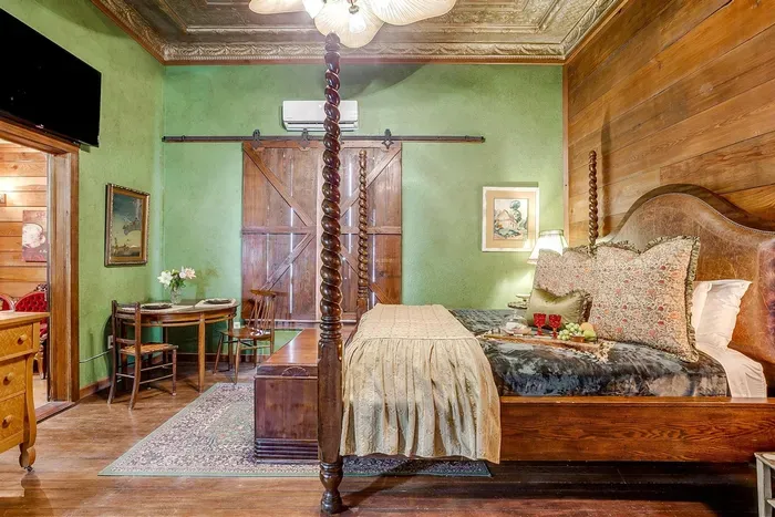 Bright and inviting room featuring a California king bed and stylish decor, perfect for a cozy getaway