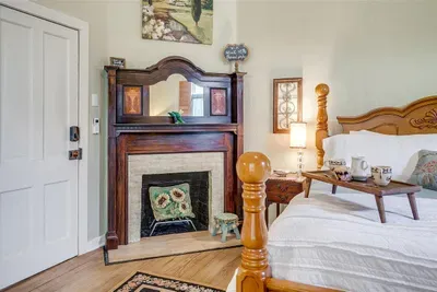 Beautiful original fireplace adds character and warmth to this elegant room
