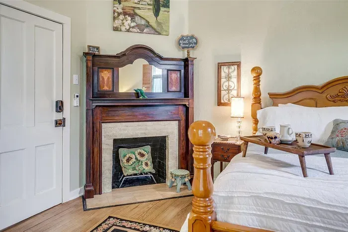 Beautiful original fireplace adds character and warmth to this elegant room