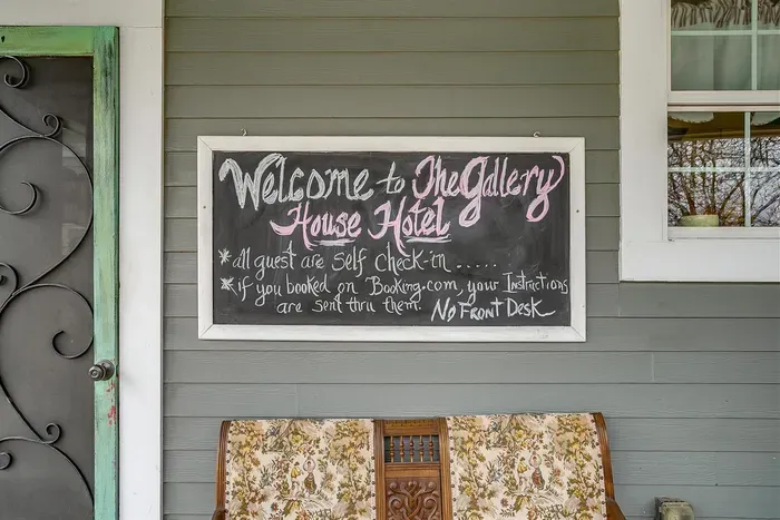 Welcome sign greets guests at The Gallery House, setting the tone for an inviting stay