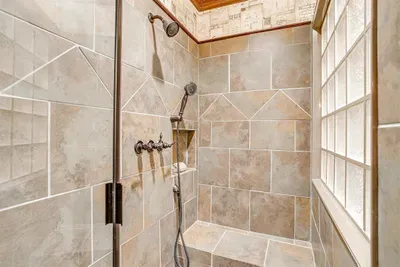 Modern walk-in shower with sleek finishes, providing a refreshing and luxurious bathing experience