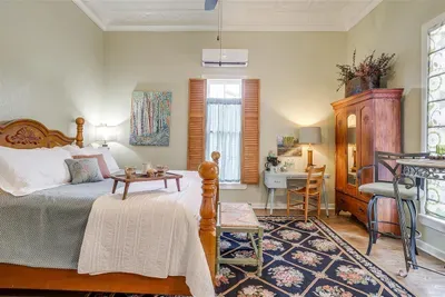 Bright and inviting room featuring a California king bed and stylish decor, perfect for a cozy getaway