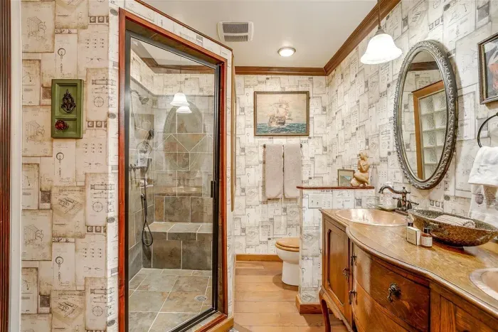 Spacious bathroom with a double vanity and plenty of counter space, perfect for getting ready in style