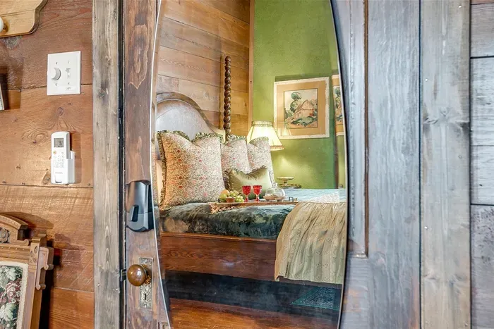 Elegant full-length mirror on the door, adding functionality and style to the space