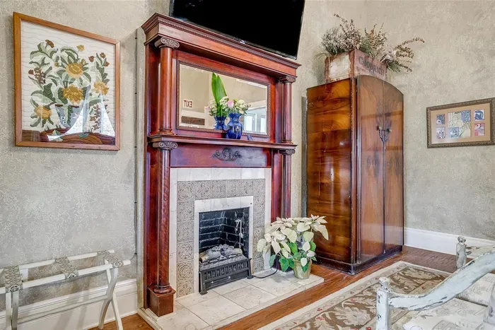 Original fireplace adds character and warmth to the room, making it the perfect place to relax and unwind