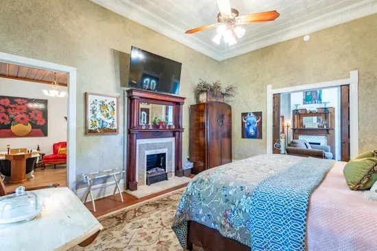 Spacious and stylish, this room features a smart TV, luxurious king bed, and unique architectural details
