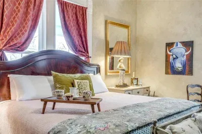 Unwind in a spacious room featuring a luxurious king bed with premium linens and a cozy coffee station for your mornings