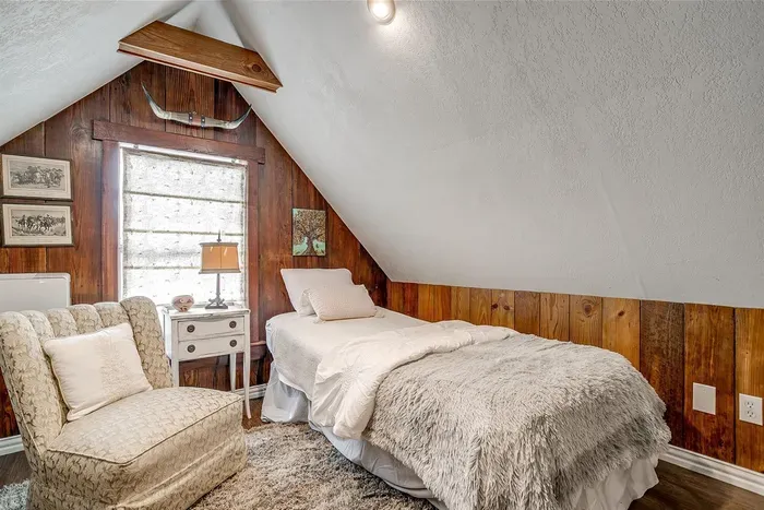Second bed in the loft area features a twin-size bed and stylish details, perfect for a restful night