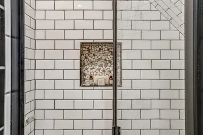 Modern walk-in shower in the private ensuite bathroom, providing comfort and convenience