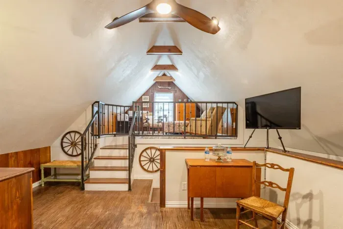 Cozy loft area with seating and thoughtful decor, providing a relaxing and inviting atmosphere