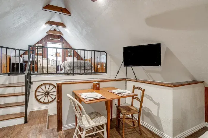 A cozy table and smart TV provide a great space for dining, working, or entertainment