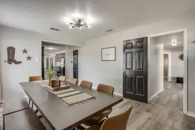 Room for everybody to sit at the table! Either additional seating at the other table on the other side of the kitchen