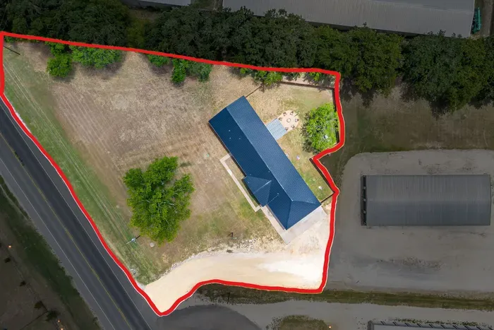Fully fenced backyard and a two-car carport, with room for up to six vehicles and trailers.