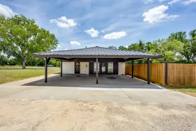 Two-car carport with the guest entrance right in front of you.