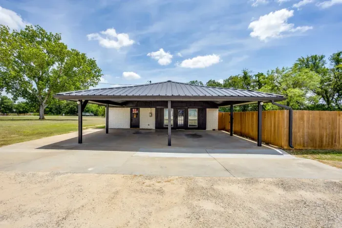 Two-car carport with the guest entrance right in front of you.