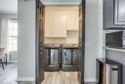 Laundry room right off the kitchen with a full-size washer and dryer.