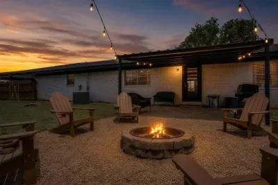 String lights come on, the fire gets going, and the backyard turns into the best room in the house. Six chairs around the pit, a gas grill on the covered patio, and plenty of room to spread out well past sunset.
