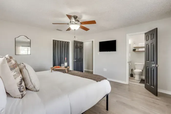 The primary has its own smart TV and a private ensuite bathroom.