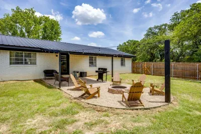 Grill under the pavilion, fire pit just outside it.