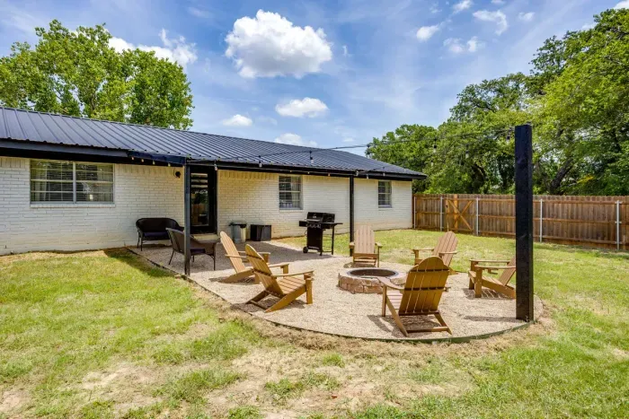 Grill under the pavilion, fire pit just outside it.