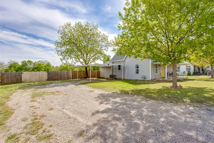 Covered parking for two vehicles plus additional driveway space — plenty of room for your whole group including trucks and trailers.