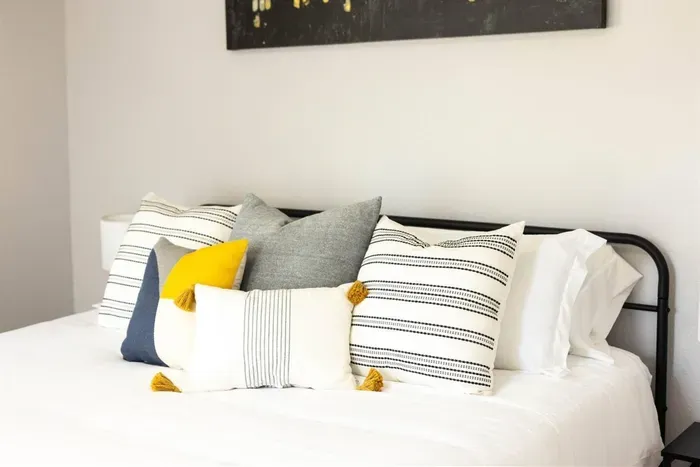 The relaxing king bed setup includes soft linens and decorative touches, ensuring a restful night’s sleep.