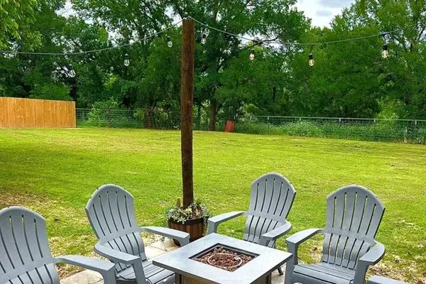 The spacious backyard and patio provide ample room for outdoor gatherings, relaxing, or playing games.