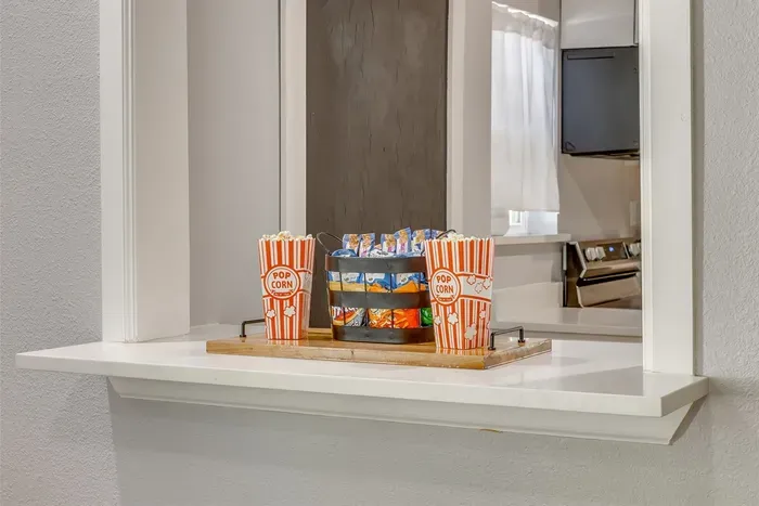 Kitchen bar area stocked with snacks and popcorn — The Hive comes ready for a good time from the moment you walk in.