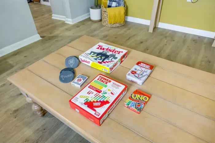 Dining table stocked with board games — Twister, Taboo, Uno, and more. Great for rainy days or late night laughs with the group.