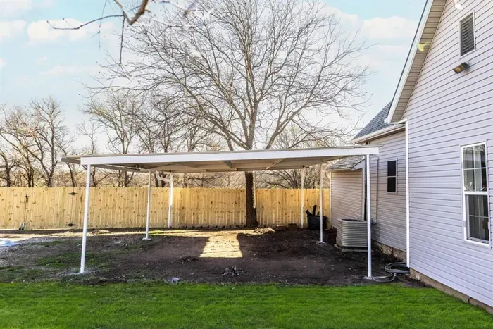 Take advantage of covered parking for two vehicles, with additional parking space available in the driveway.