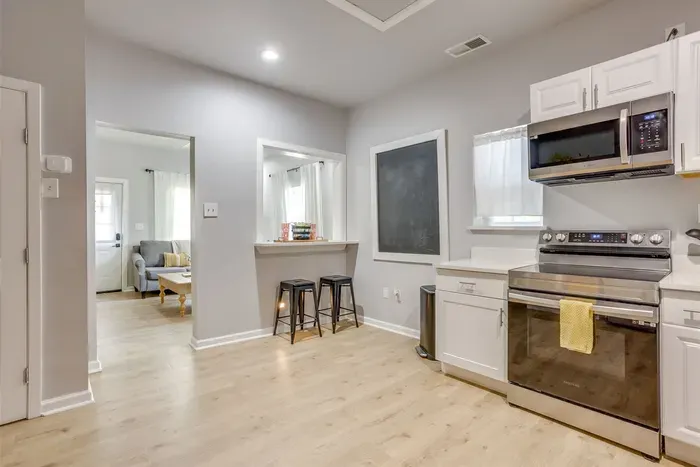 Kitchen opens directly into the living room — the open concept layout makes this home feel spacious and connected for group stays.