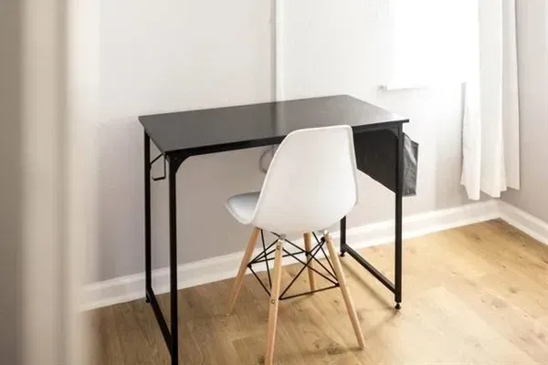 A functional work desk in the king bedroom offers a quiet space for remote work or study during your stay.