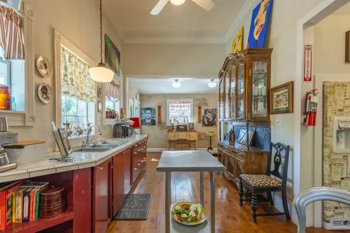 With its vibrant design and fully equipped setup, this kitchen serves as the heart of the common area. Whether you're enjoying a cup of coffee or preparing a full meal, it’s a welcoming space that encourages guests to gather and share.
