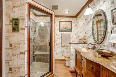 Experience spa-like luxury in the private ensuite bathroom with a spacious walk-in shower and built-in bench